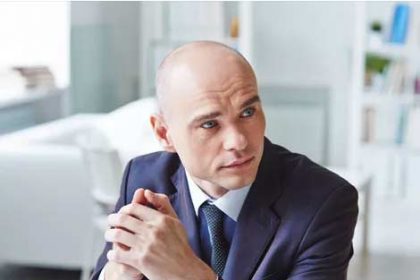 A professional businessman considers Australian study abroad opportunities for students.