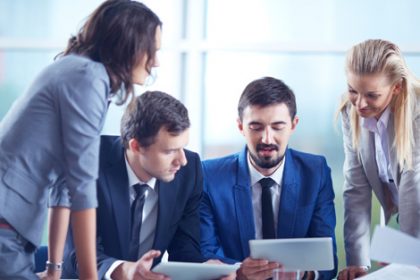 A business team discusses financial viability risk assessment during a collaborative meeting.