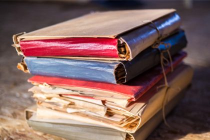 Vintage books represent researching ASQA audit reports for vet sector compliance.