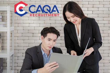 A business professional conducts a job interview, highlighting CAQA's recruitment services.