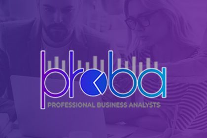 Business analysts work together on a laptop, offering solutions for organisations needing vet compliance.
