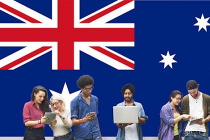 Students use technology with the Australian flag, reflecting job losses in the vet sector.
