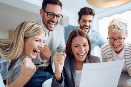A business team collaborates on a document, representing a data-driven approach to vet sector improvements.