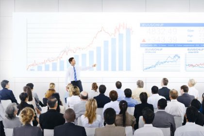 A business presentation shows data visualization relevant to vet compliance.