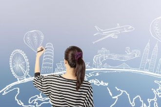 A woman illustrates a world map with landmarks, representing reasonable adjustments for international students in vet sector.