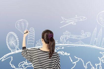 A woman illustrates a world map with landmarks, representing reasonable adjustments for international students in vet sector.