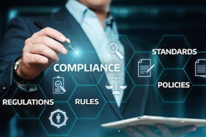A compliance officer reviews government regulations for an RTO training organisation.