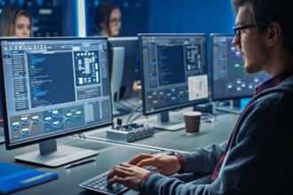 Students coding at computers highlights the need for cyber security in Australian education.