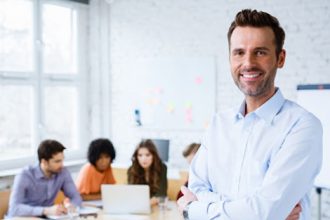 A professional demonstrates effective team leadership during a VET training session.