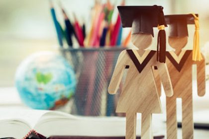 Graduation caps and school supplies represent issuing qualifications to trainers and staff in the vet sector.