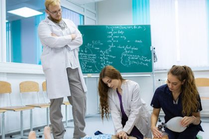 Medical students perform CPR training, demonstrating practical skills in healthcare.