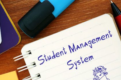A notebook displays 'Student Management System', illustrating the importance of a good system for RTO training.