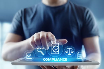 A person uses a digital tablet for vet compliance, showing data security and regulatory icons.