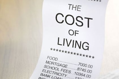 A receipt shows high household expenses impacting international students' finances.