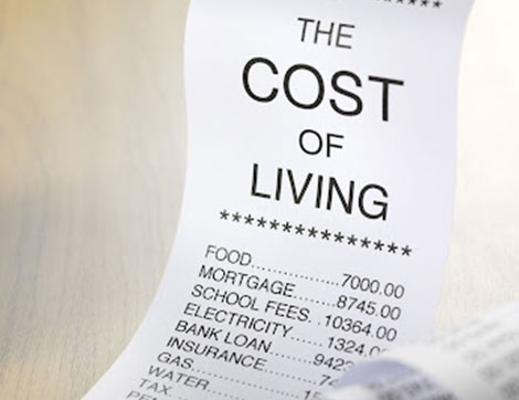 A receipt shows high household expenses impacting international students' finances.