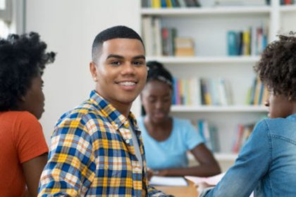 Students collaborate in a classroom setting, highlighting the importance of student engagement in the vet sector.
