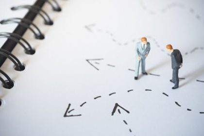 Miniature figures represent strategic planning for RTO training and navigating the vet sector.