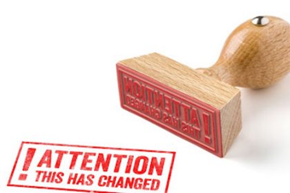A red 'Attention This Has Changed' rubber stamp highlights frequent changes in the vet sector.