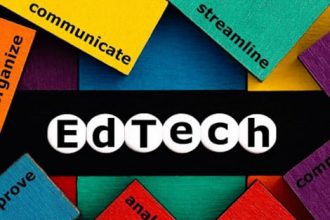 Colorful wooden blocks spell 'EdTech' representing innovation in the vet sector.