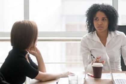 A team discusses strategy during a business meeting, highlighting effective RTO training.